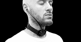 Man meditating with Inpulse, a screen-free analog device that lets him hear his breath in real time.